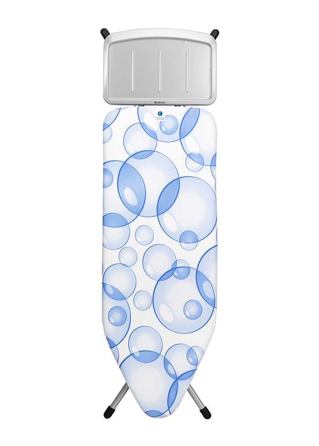 Table à repasser blanche avec motif bulles bleues. Pieds argentés et repose-fer.