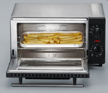 Toaster oven with fries inside, door open, and a control panel.