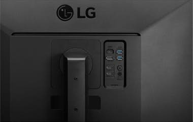 La parte trasera de un monitor LG negro con soporte y puertos laterales.