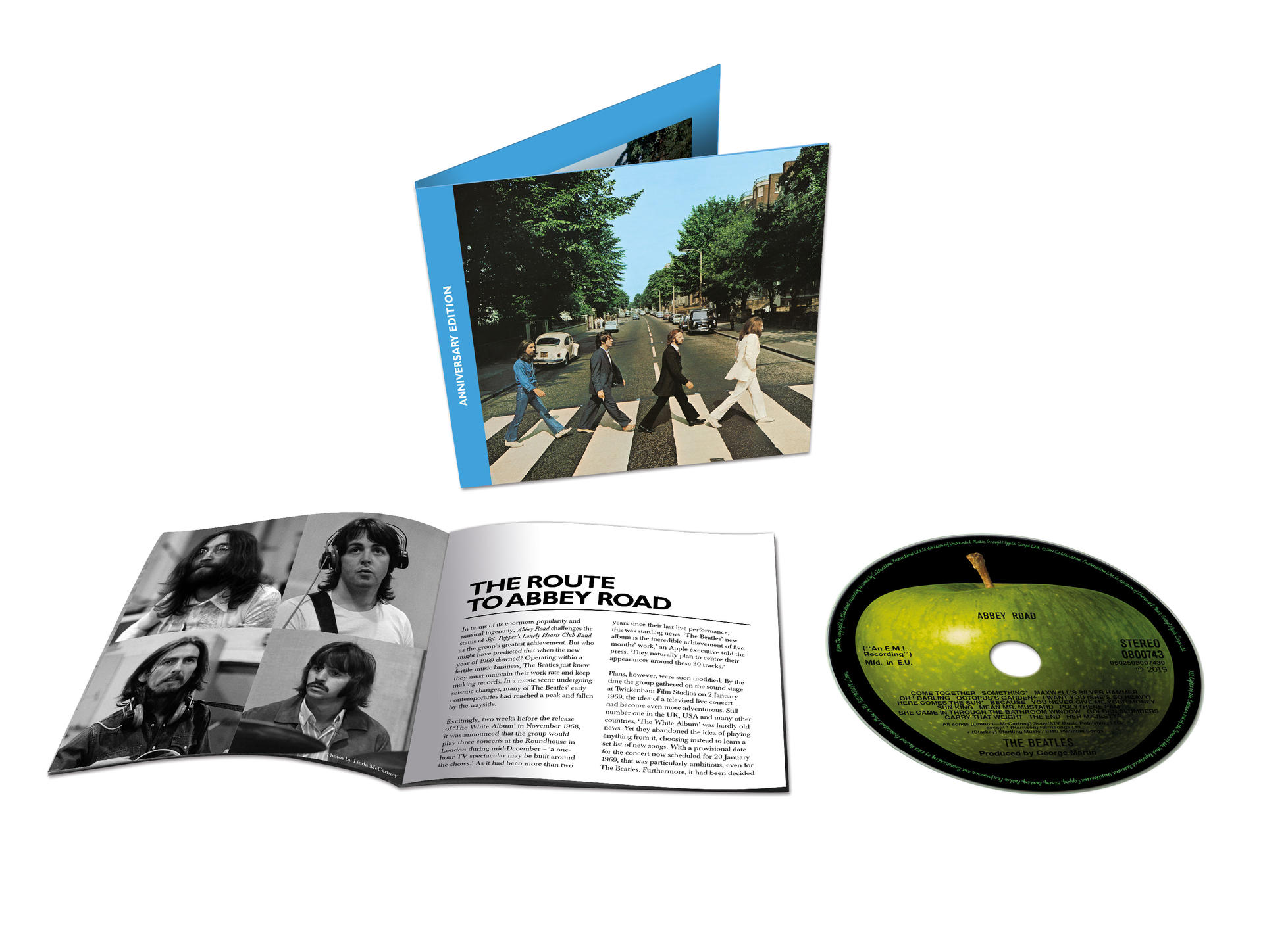 A Beatles Abbey Road album borítója, az ikonikus zebrán átkelő képpel és egy füzettel.