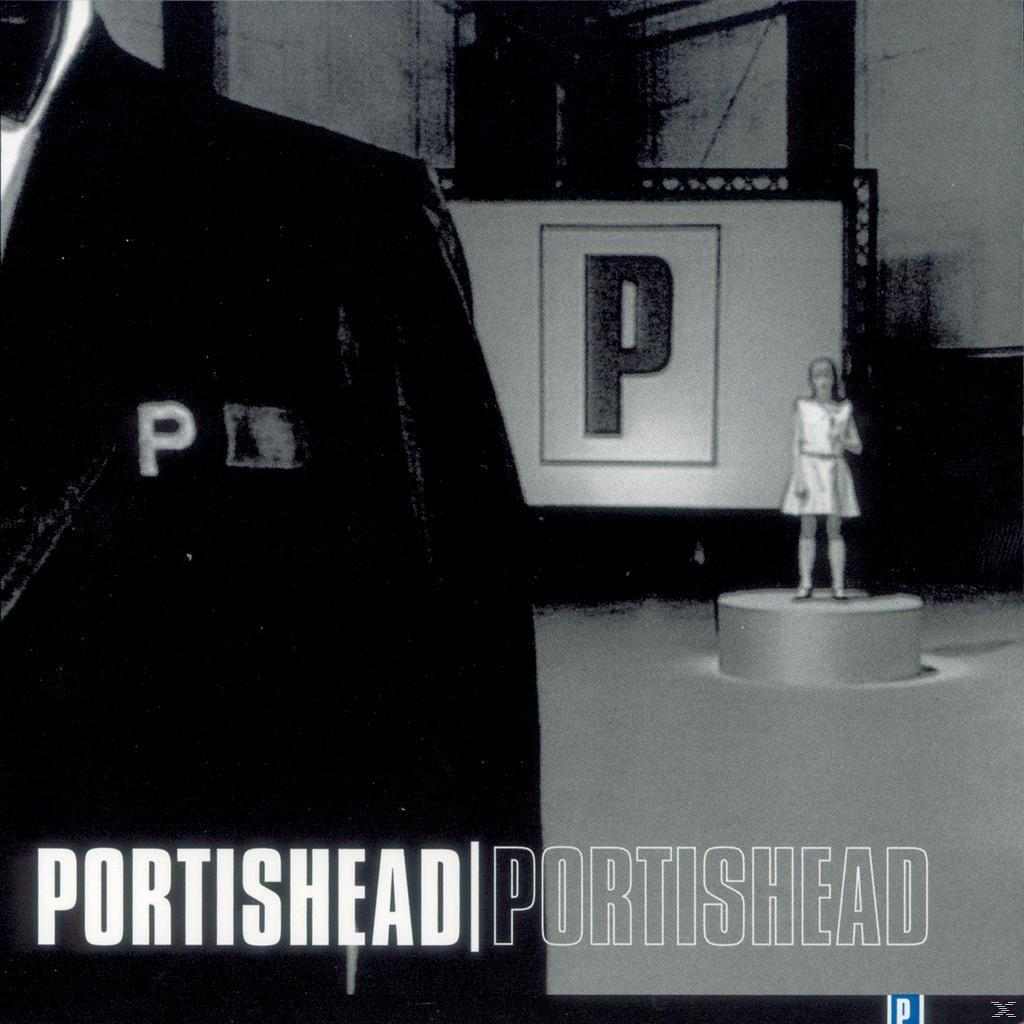 Portishead album cover. Person in black suit, a small girl on a platform, and the letter P.
