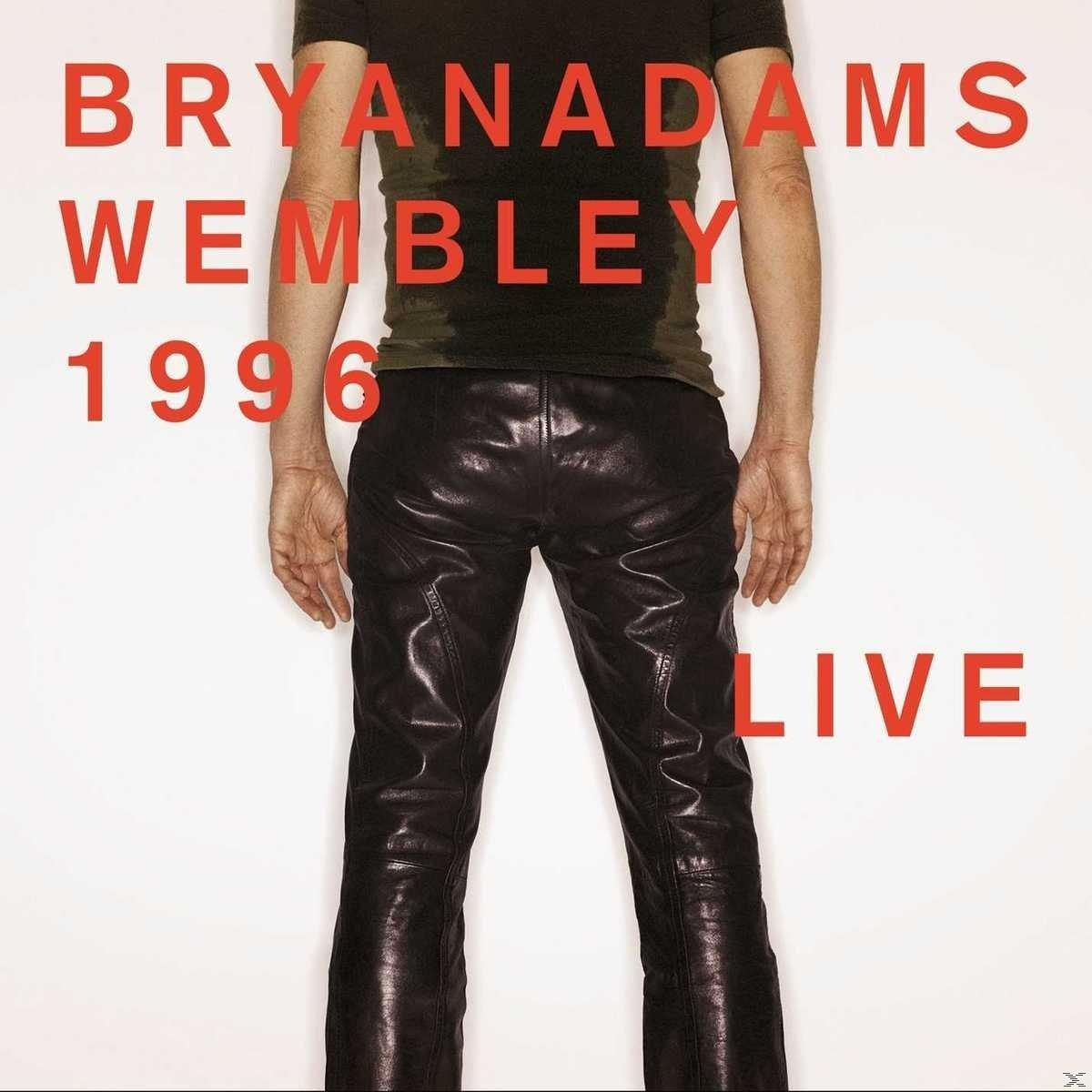 Un homme en pantalon de cuir, avec texte rouge 'BRYAN ADAMS WEMBLEY 1996 LIVE'.