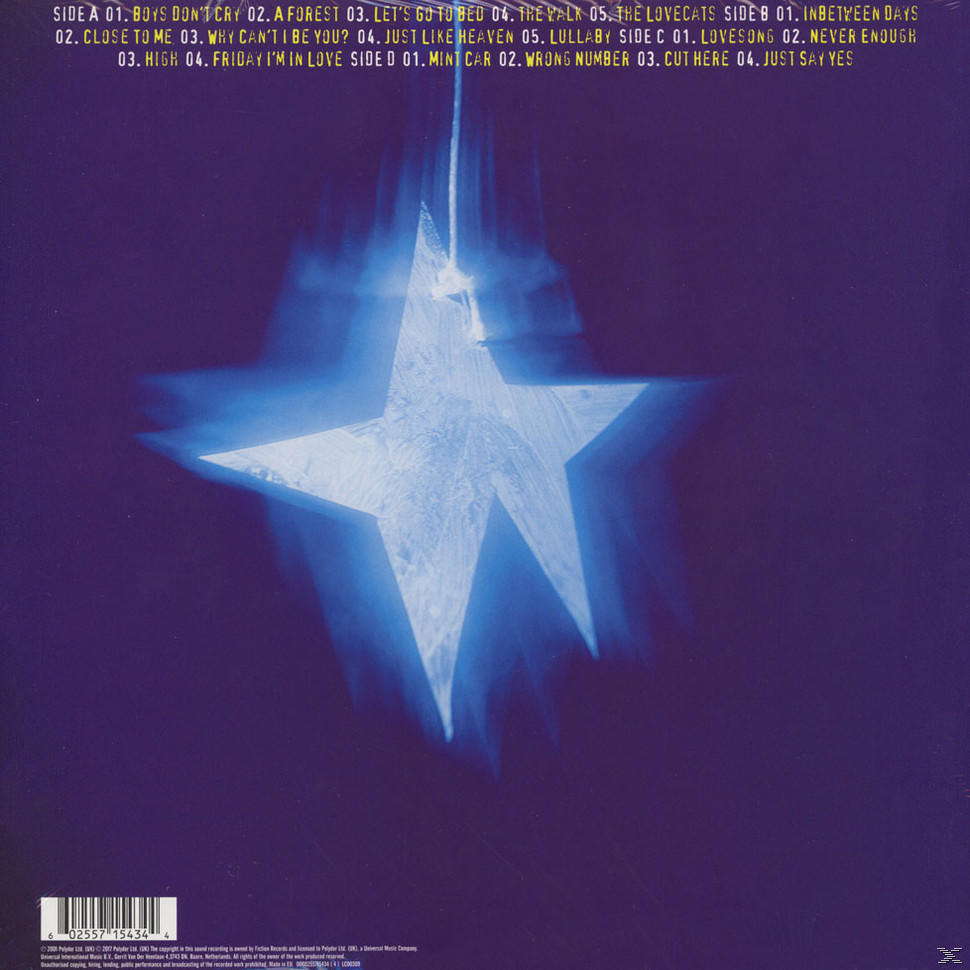 La pochette arrière d'un disque vinyle bleu avec une étoile blanche et des titres de chansons.