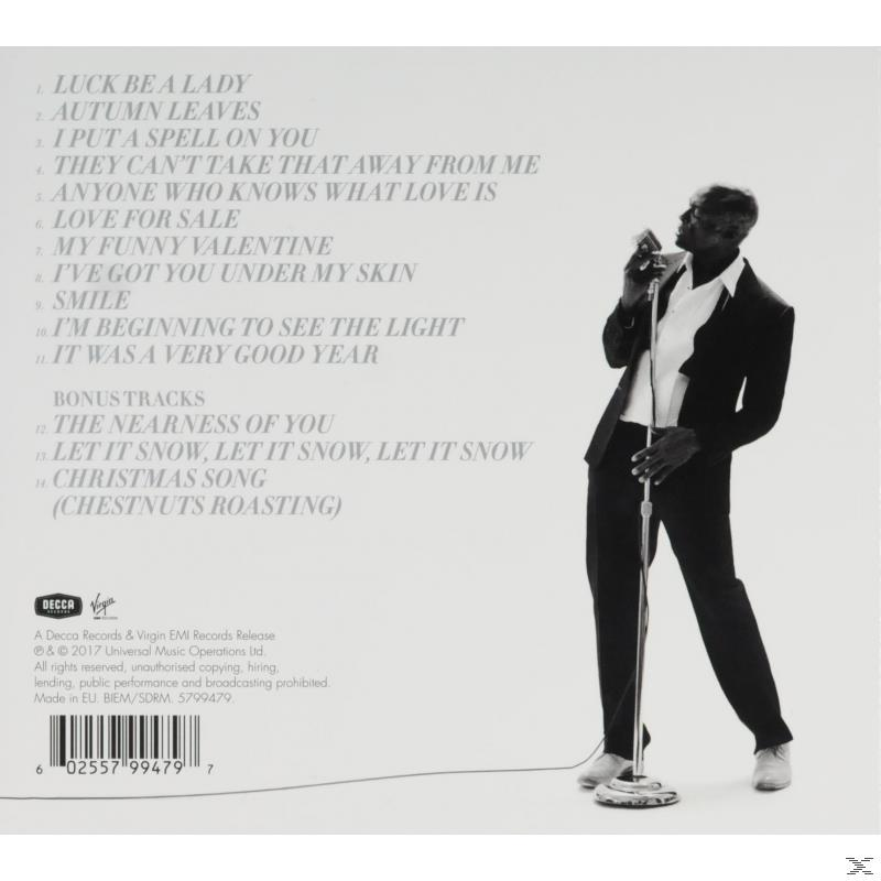 Albumhoes: Man zingt in een microfoon, songteksten links.