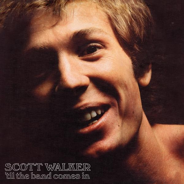 Scott Walker albumhoes, lachende man met bruin haar. De titel is 'til the band comes in'.