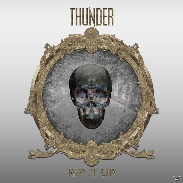 Schädelbild in einem goldenen Rahmen, mit 'THUNDER' oben und 'RIP IT UP' unten.