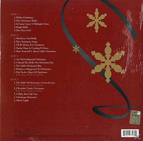 Die Rückseite einer roten Schallplatte mit Songtiteln und goldenen Verzierungen.