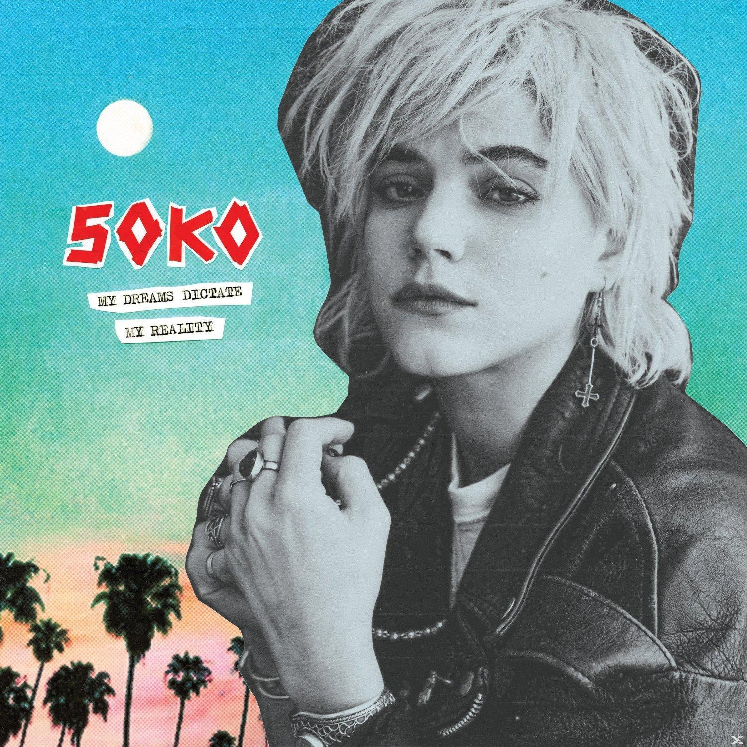 Albumcover: Soko blickt den Betrachter an, trägt eine Lederjacke, Ringe und Ohrringe. Der Hintergrund ist blau.
