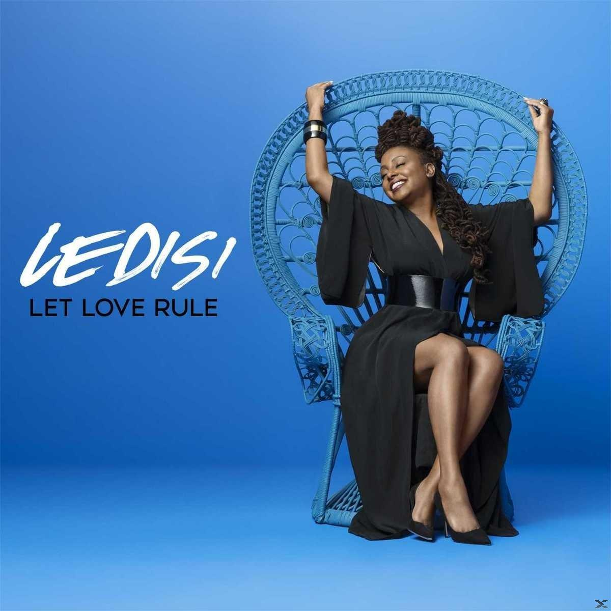Album borító: Ledisi kék széken ül. Szöveg: Ledisi, Let Love Rule. Fekete ruhát visel.