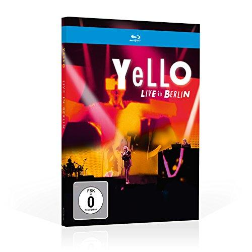 Yello Live in Berlin koncert DVD tokja. A zenekar tagjai a színpadon láthatók.