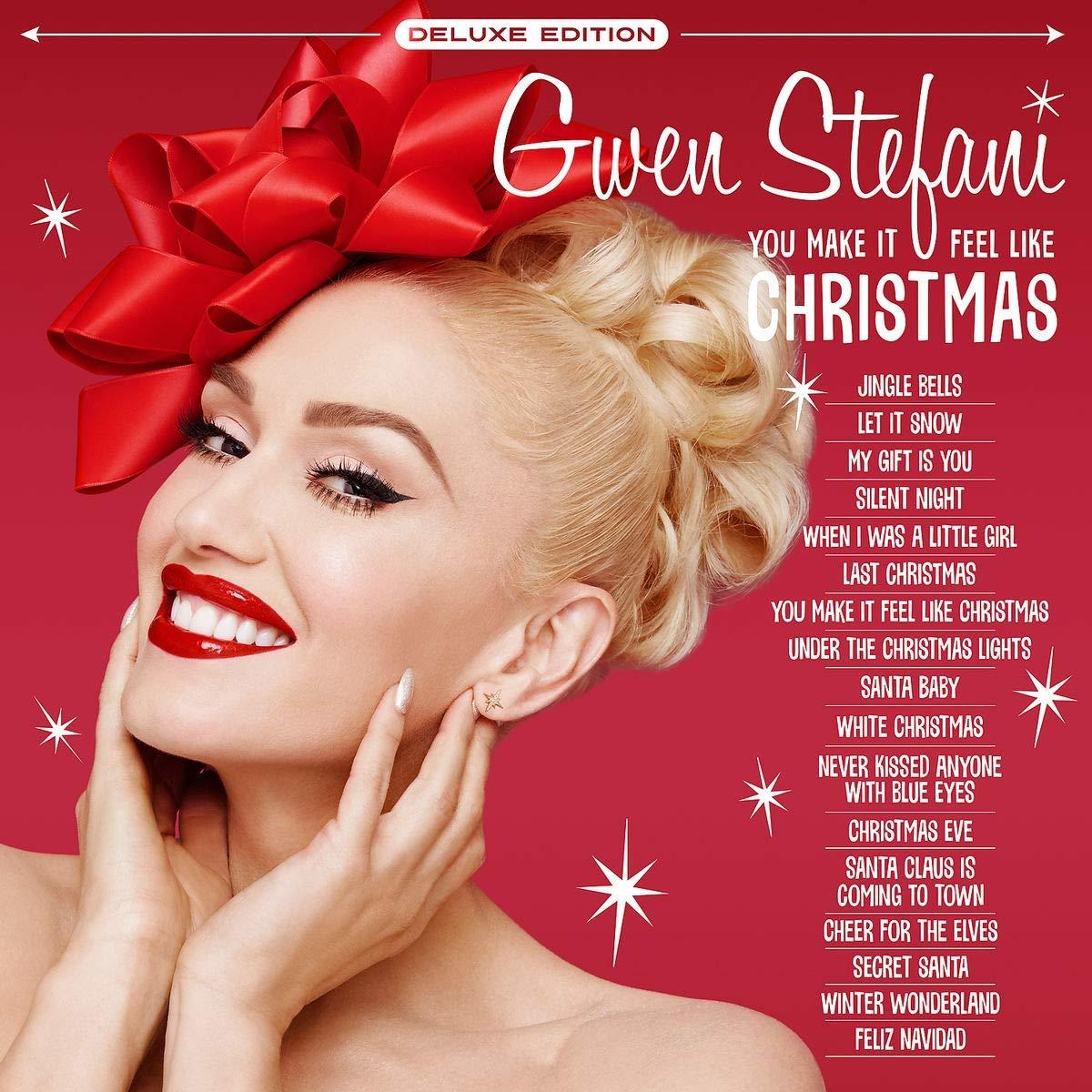 Gwen Stefani album borítója. Mosolyog, piros rúzzsal és nagy piros masnival. Karácsonyi témájú.