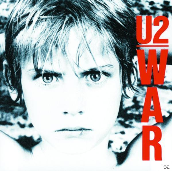 U2 album borító, egy gyermek arcának közeli képe, piros szöveg.