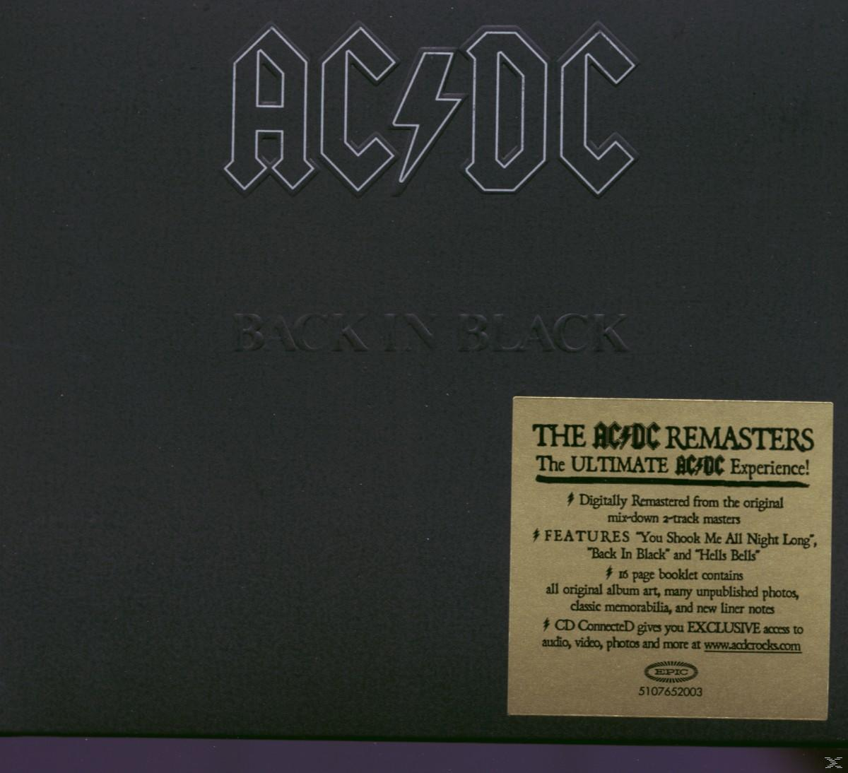 Pochette d'album AC/DC, fond noir. Texte : 'AC/DC' et 'BACK IN BLACK'. Un autocollant avec du texte est à droite.