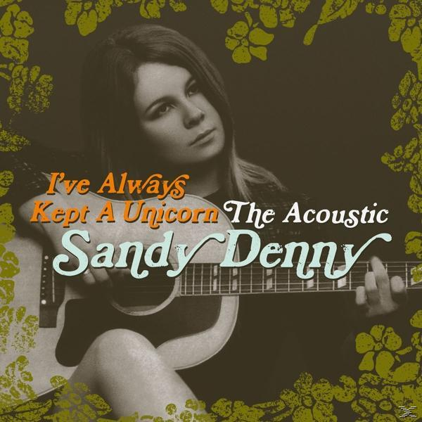 Sandy Denny met akoestische gitaar. Albumhoes met tekst: I've Always Kept A Unicorn, The Acoustic. Bloemenframe op de achtergrond.