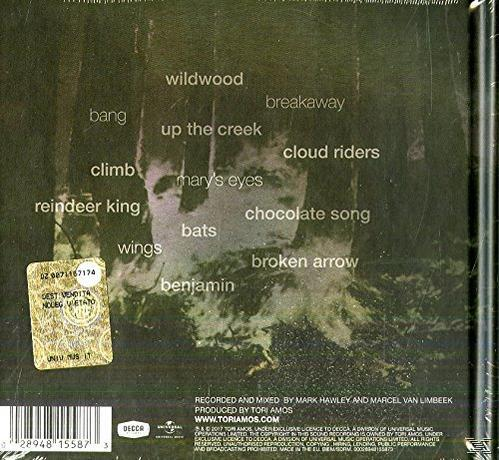 Achterkant van een cd met songteksten en een bosafbeelding. De tekst bevat titels van nummers.