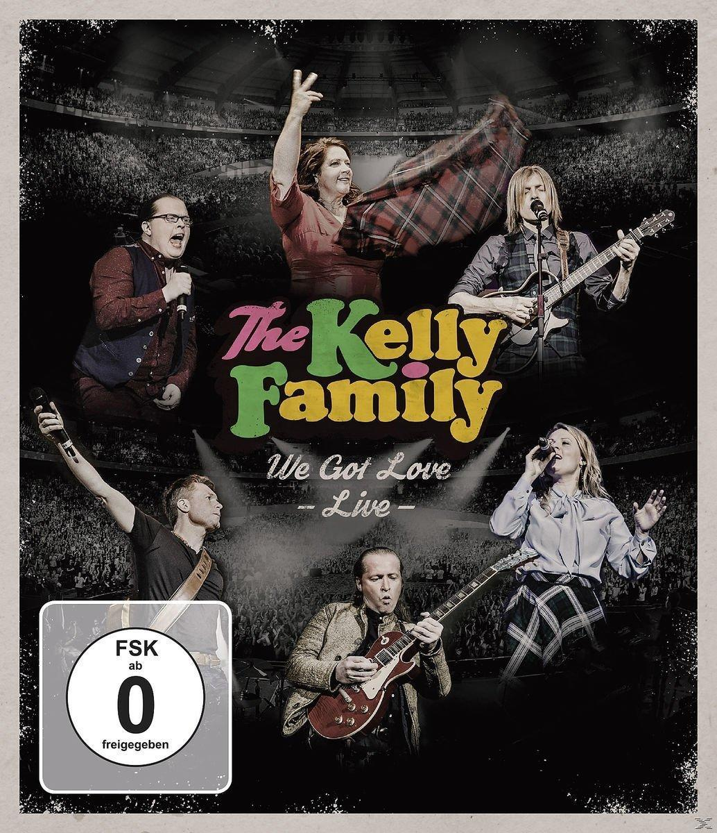 Albumhoes: The Kelly Family, band op het podium. Tekst: The Kelly Family, We Got Love Live.