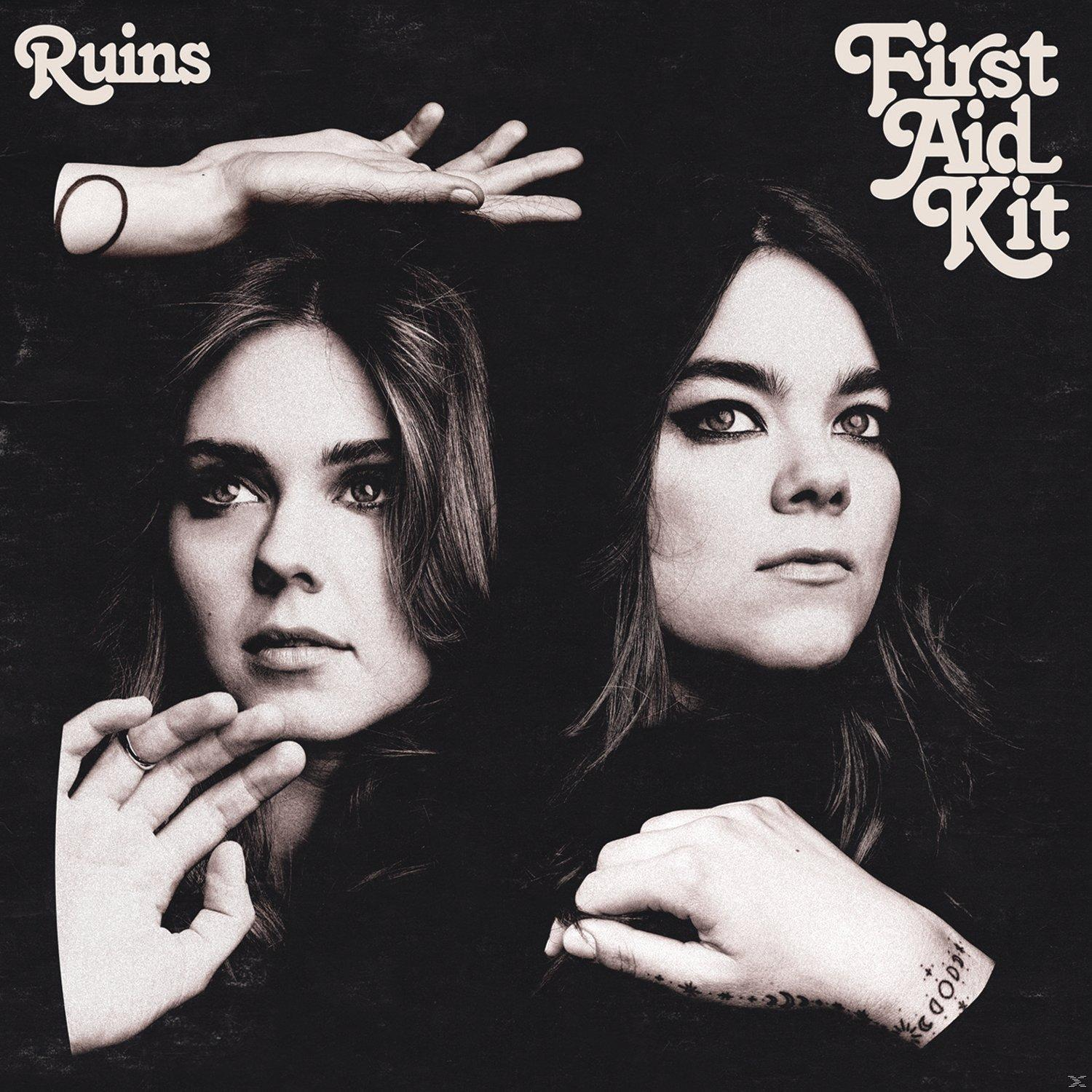Albumcover: Twee vrouwen in sepia. Eén hand bovenop, de andere ervoor met een ring. Tekst: Ruins, First Aid Kit.