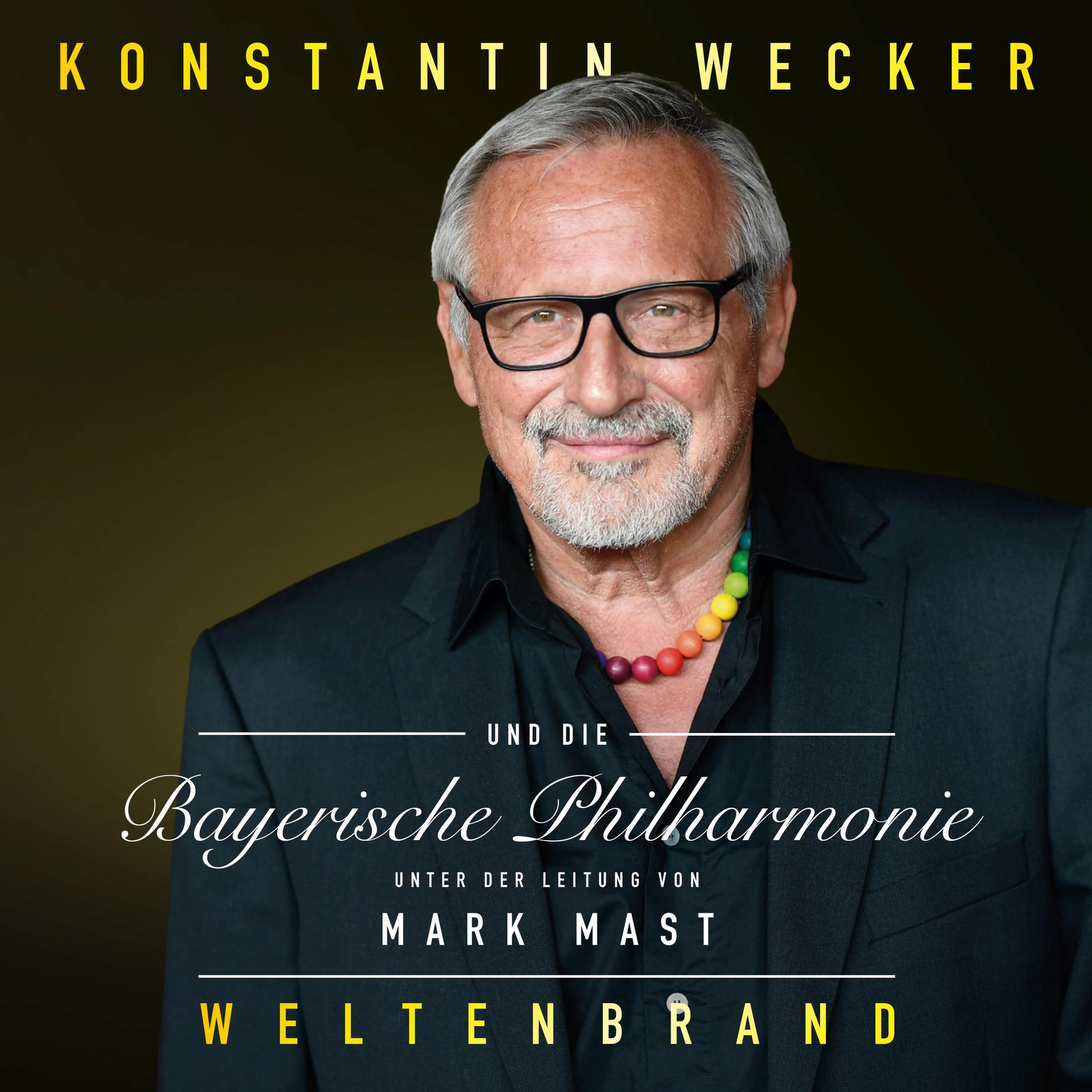 Albumcover, Mann im Anzug und Brille mit Text. Konstantin Wecker.