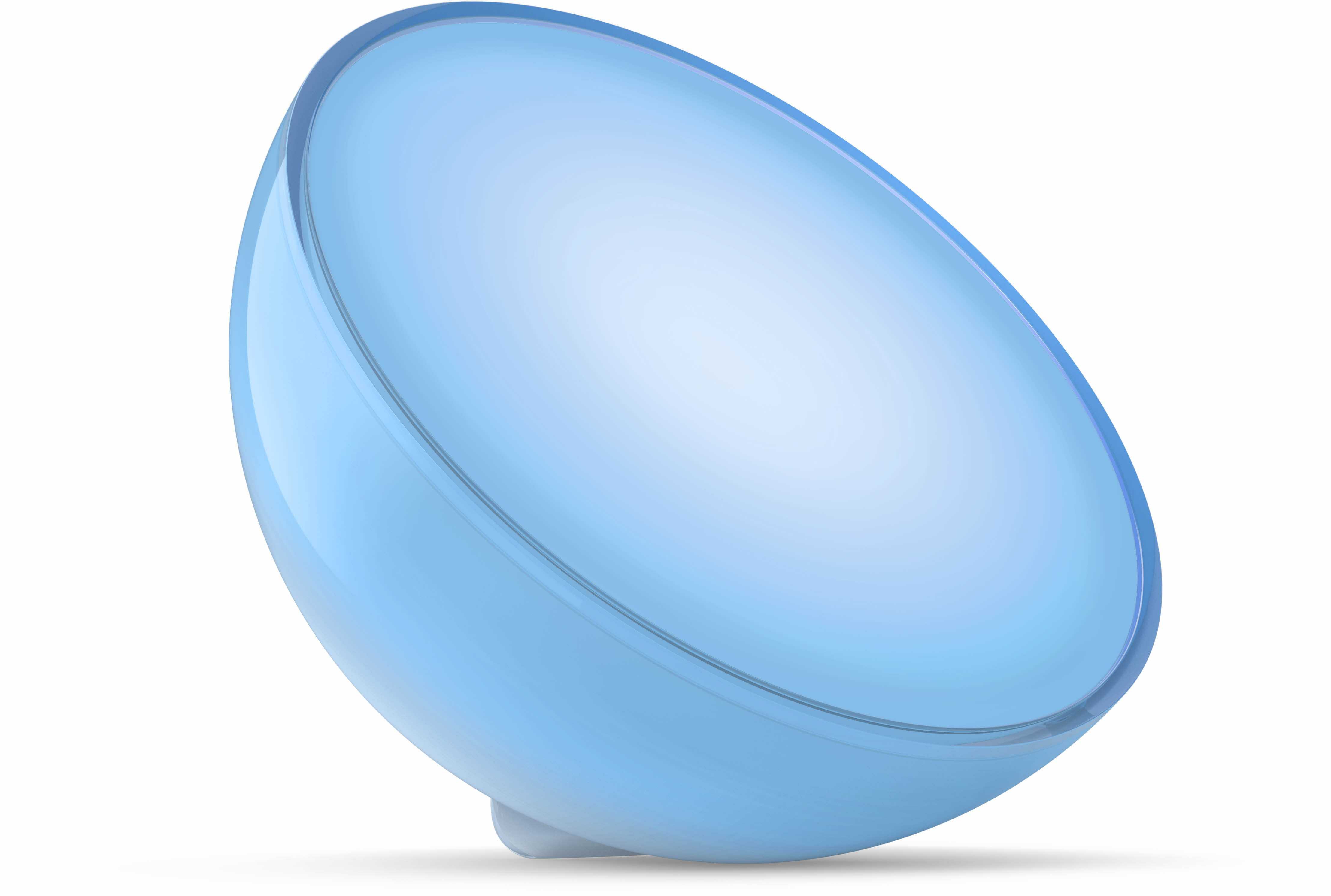 Lampe bleue, en demi-sphère, sur fond blanc. C'est un design moderne, avec une petite base.