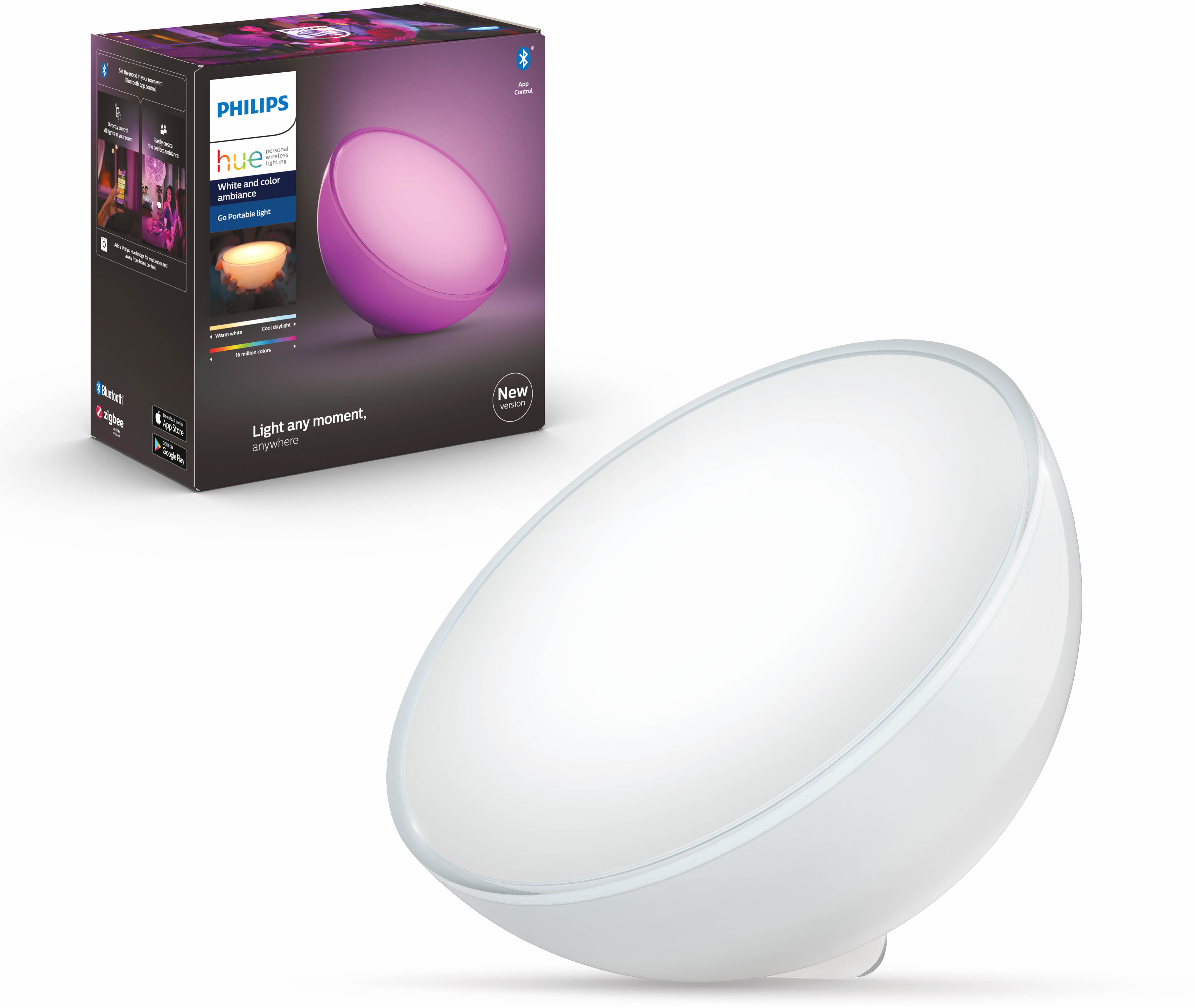 Une lampe Philips Hue blanche et violette. La boîte est à l'arrière-plan. La lampe est sur une surface blanche.