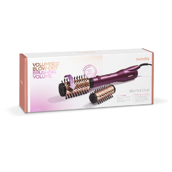 Cepillo de peinado en una caja con cuerpo morado, con fondo blanco.