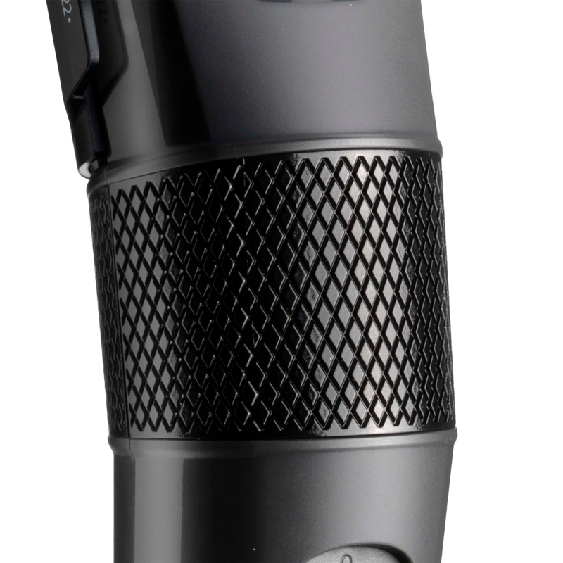 Close-up of a black object with diamond-shaped textured grip.
