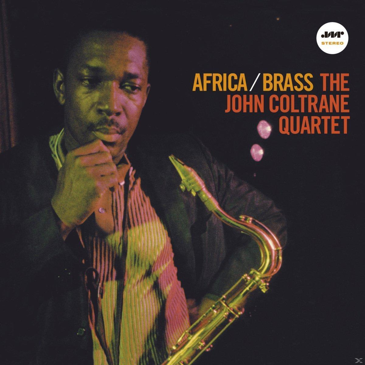 John Coltrane album borítója. Szaxofont tart. A cím: "Africa/Brass".