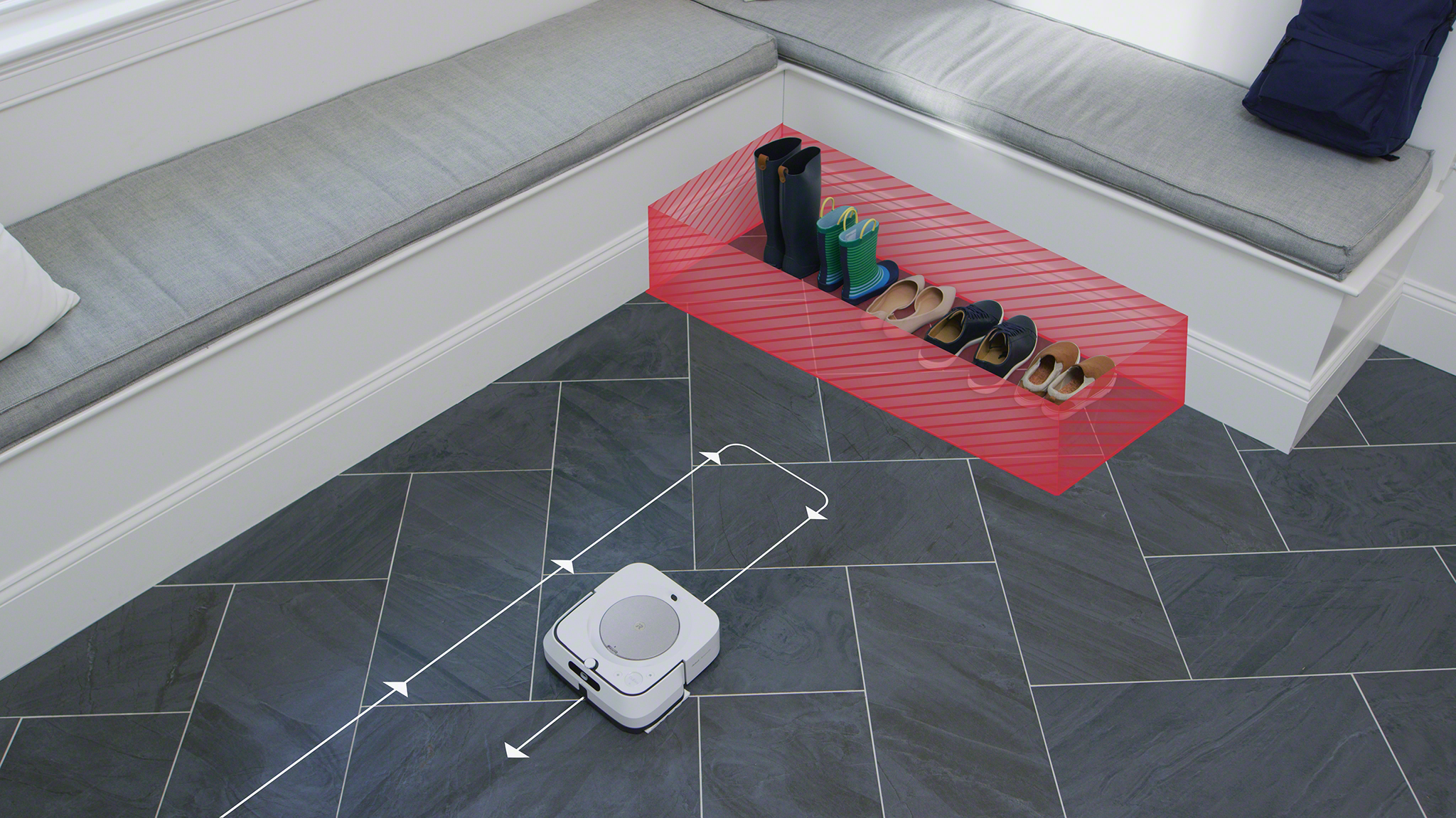 Robot vacuum cleaning around a shoe rack with shoes, near a gray bench.