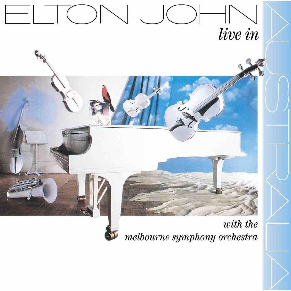 Albumcover. Weißes Klavier, Geigen und ein Himmelshintergrund mit Elton Johns Namen oben.