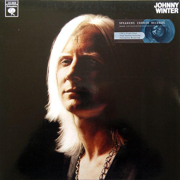 Johnny Winter albumborító, közeli portré hosszú fehér hajjal.