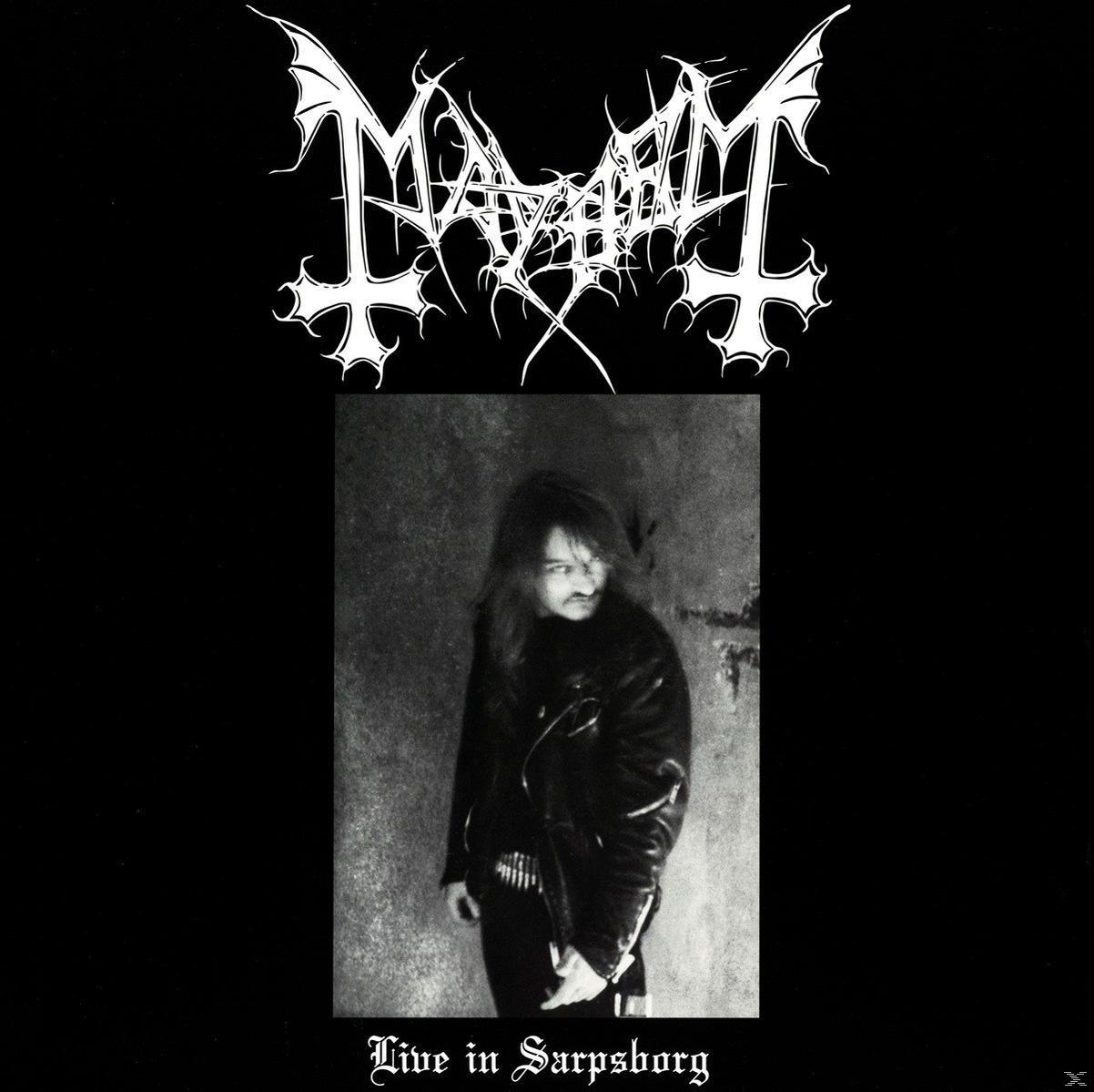 Albumcover mit schwarzem Hintergrund und einem Bild eines Mannes in schwarzer Jacke.