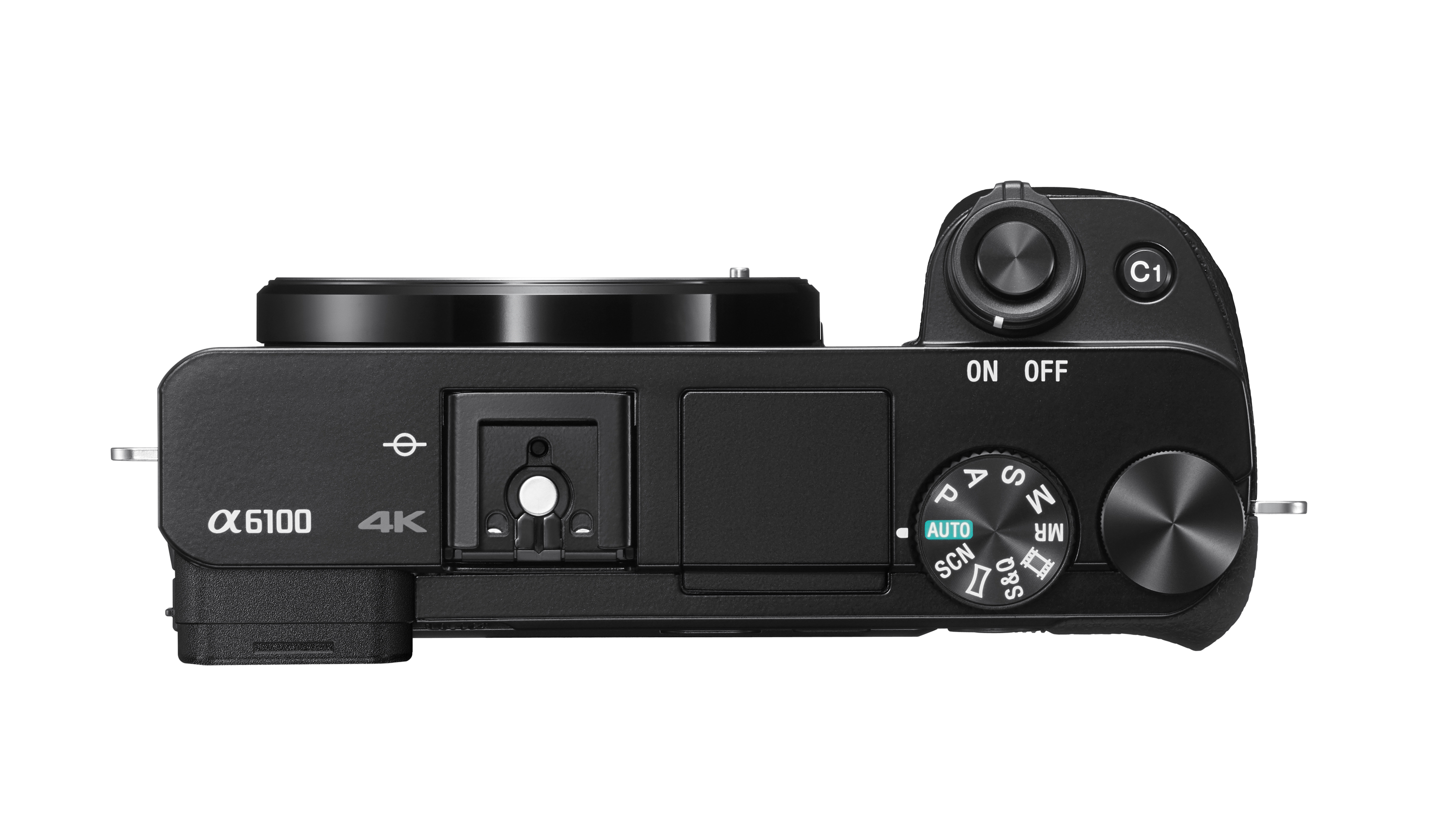 Top view of a black camera with lens and control dials. The on/off switch is visible.