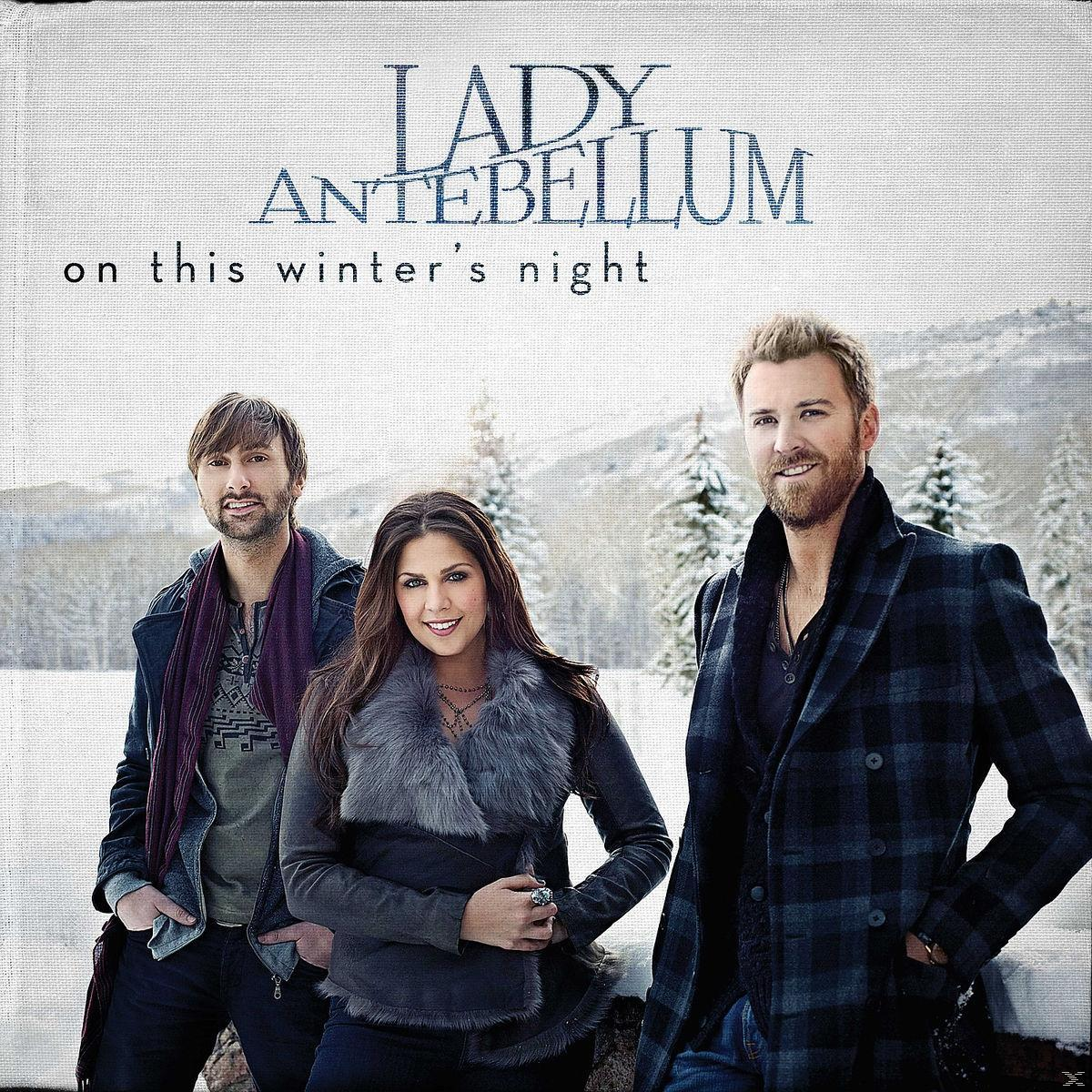 A Lady Antebellum trió téli ruhában, havas táj előtt áll az album borítóján.