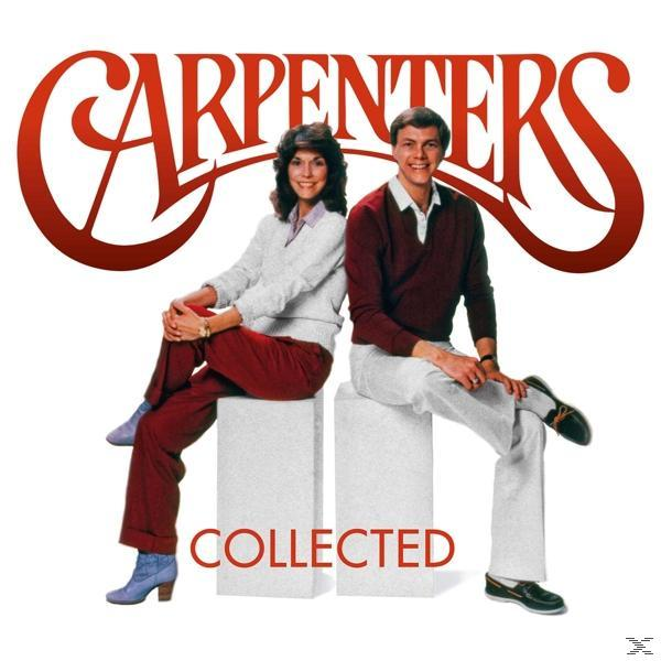 Carpenters album borító; két ember fehér blokkokon ül. A háttér fehér.