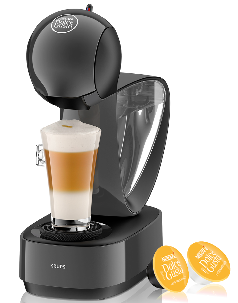Schwarze Krups Nescafe Dolce Gusto Kaffeemaschine mit Latte Macchiato im Glas. Zwei Kaffeepads.