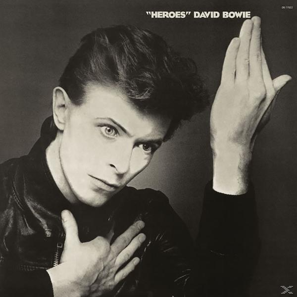 Albumhoes, David Bowie, zwart-wit, hand omhoog, leren jas.