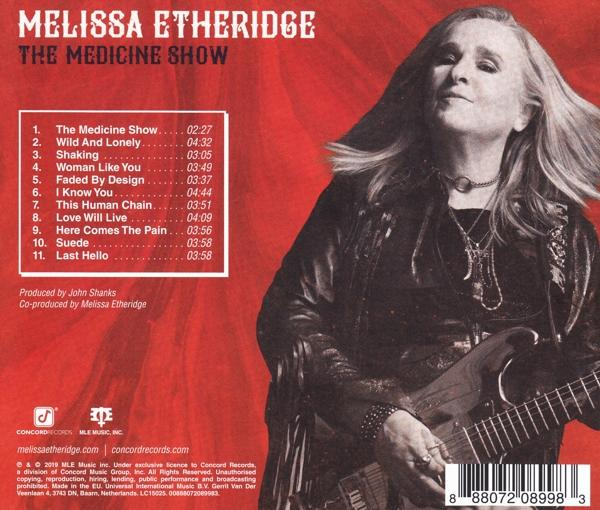 Melissa Etheridge album borítója, piros háttér, Melissa fotója gitárral. A bal oldalon a számlista.