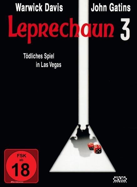 DVD-Cover: Leprechaun 3. Schwarzer Hintergrund, eine weiße schiefe Ebene mit Würfeln und rotem FSK-Logo.