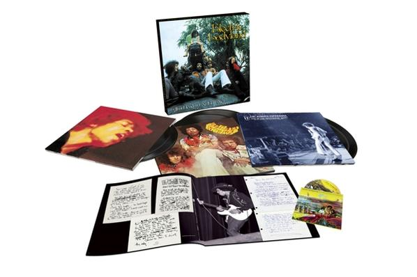 Album-Set mit Schallplatten, Fotos und einem Booklet, das eine Band zeigt.