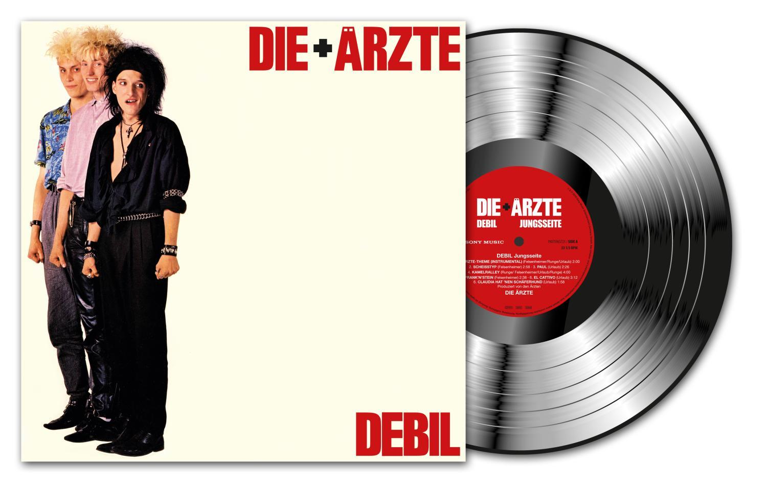 Albumcover mit Bandmitgliedern, Albumtitel: Debil und einer silbernen Vinylplatte.