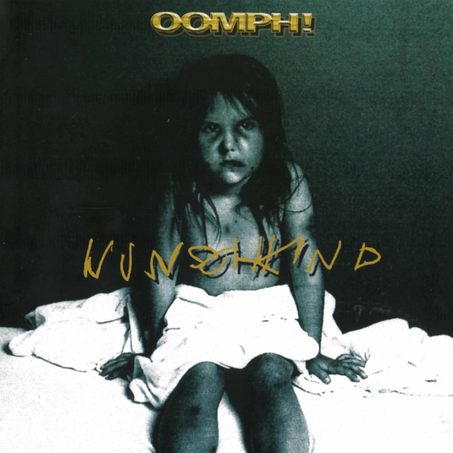 Albumcover: Kind sitzt auf Bett, weißes Handtuch, Text 'Wunschkind' und Bandname 'Oomph!'