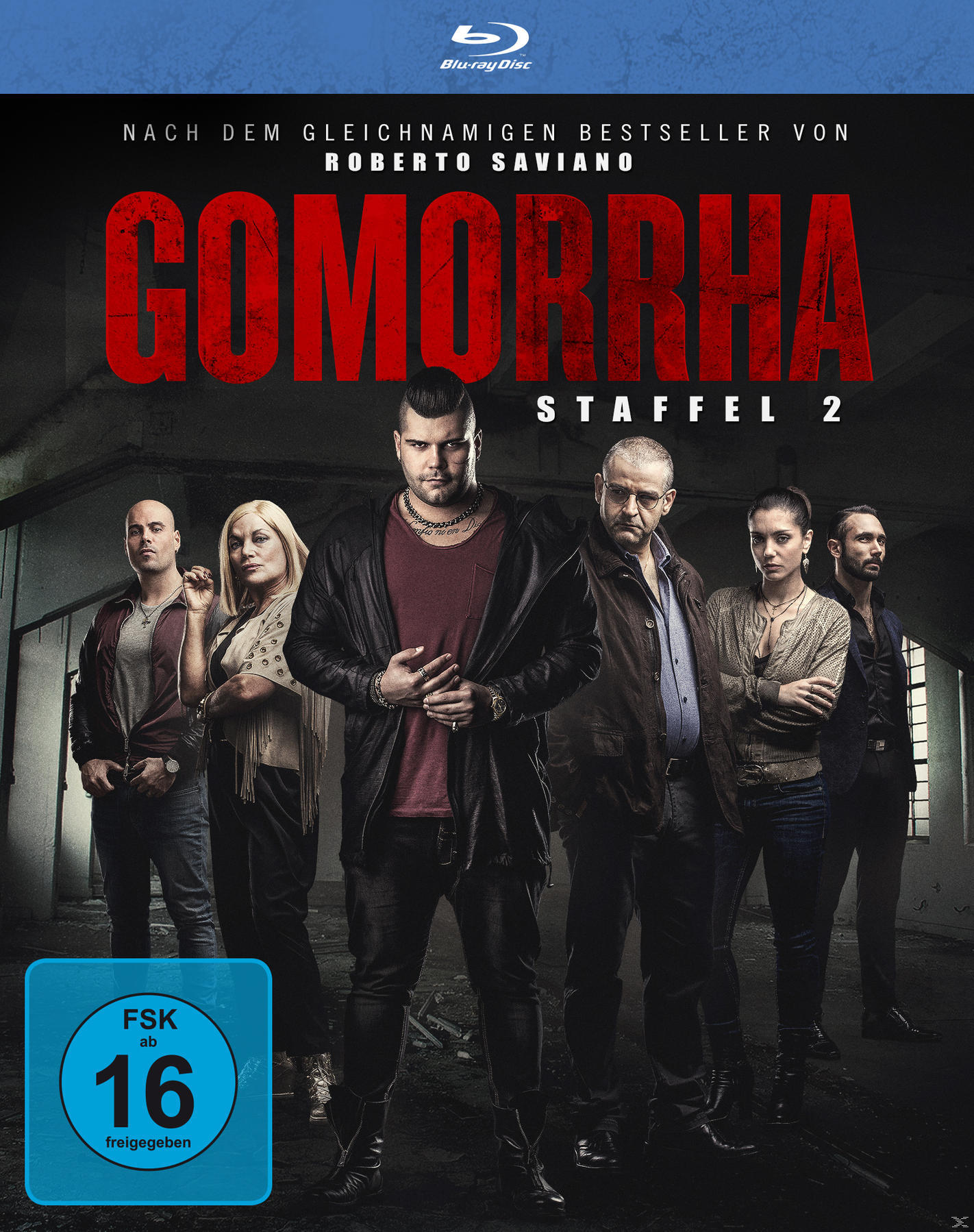 DVD-Cover, eine Gruppe von Menschen steht zusammen in einem dunklen Raum. Der Titel ist Gomorrha.