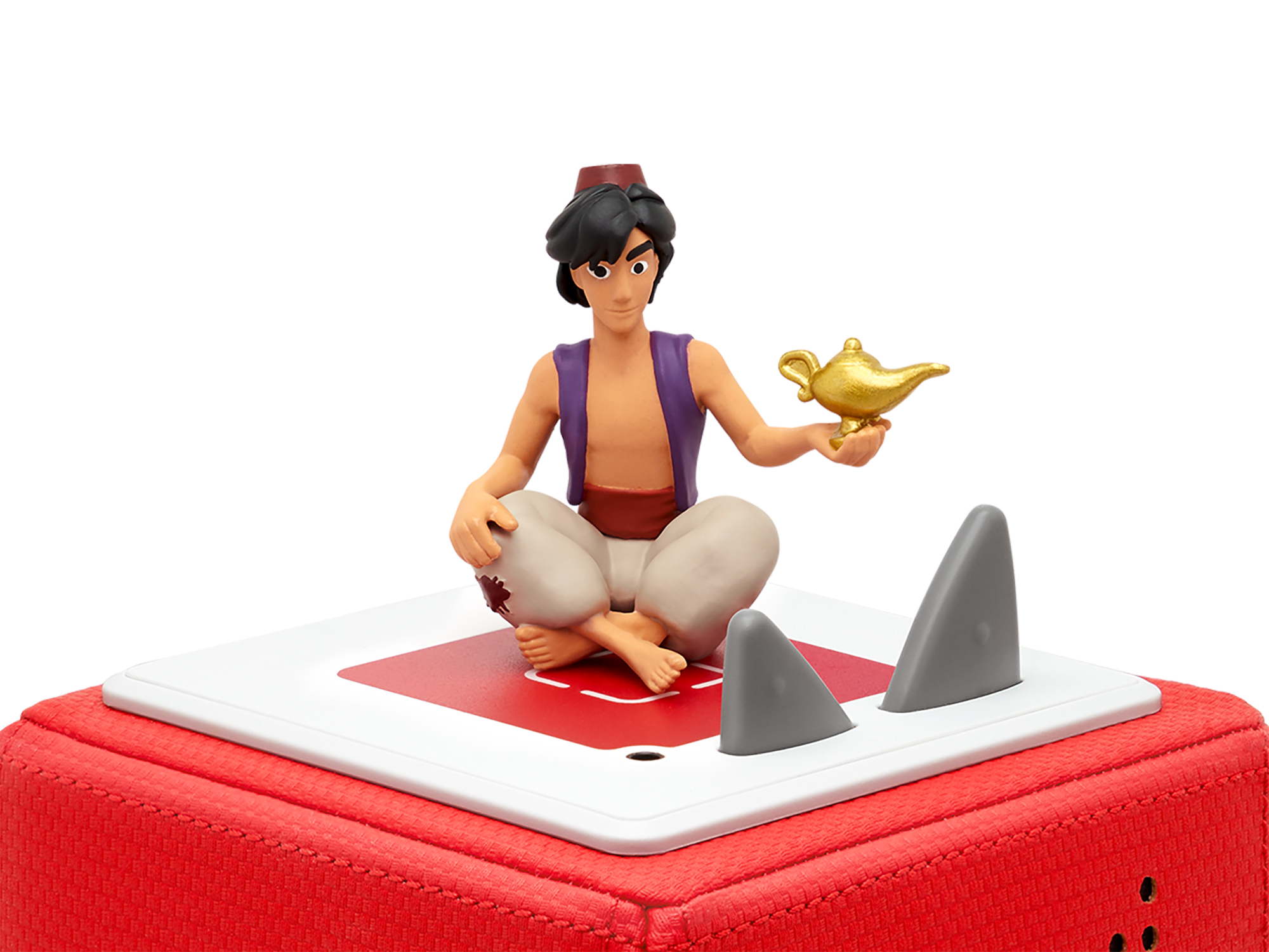 Aladdin-Figur auf roter Plattform. Aladdin hält die Lampe, mit Haifischflossen.