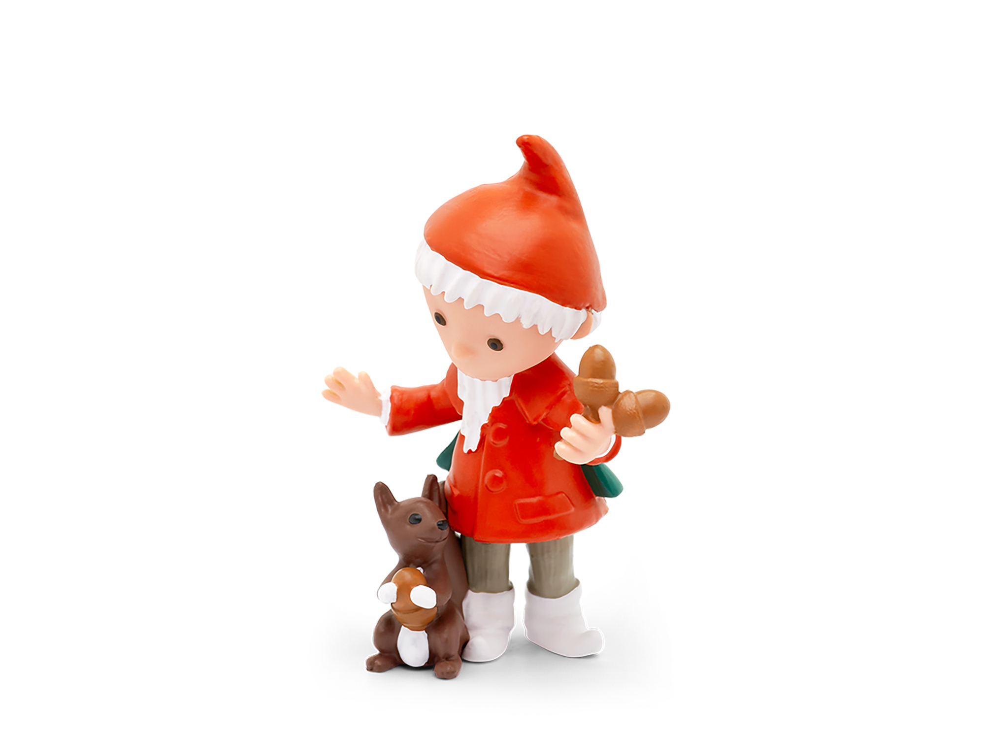 Eine Figur eines Jungen in rotem Mantel und Hut, der ein Brötchen hält, mit einem Hund.