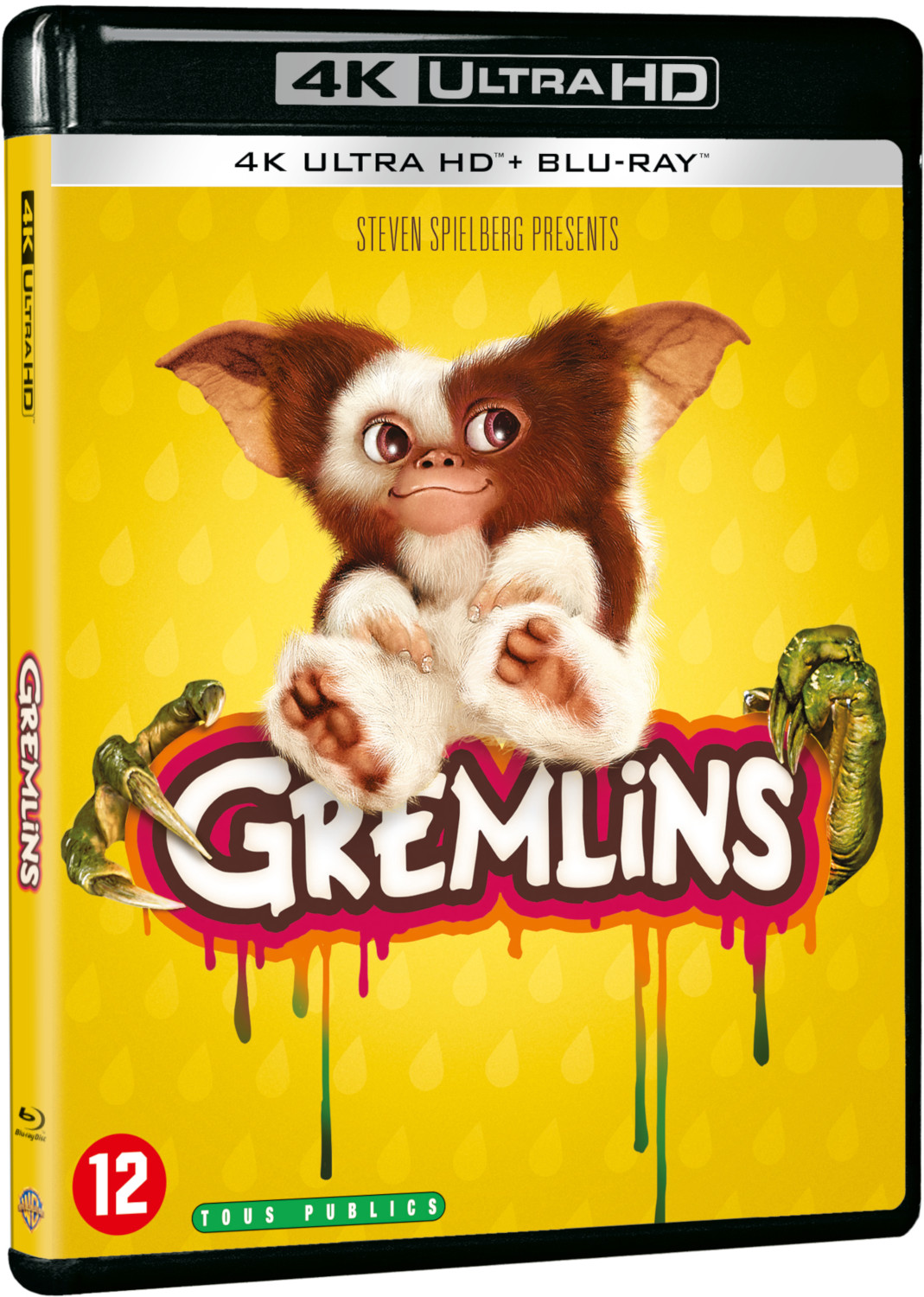 Boîtier de disque Blu-ray 4K Ultra HD Gremlins avec le personnage Gremlin et un fond jaune.