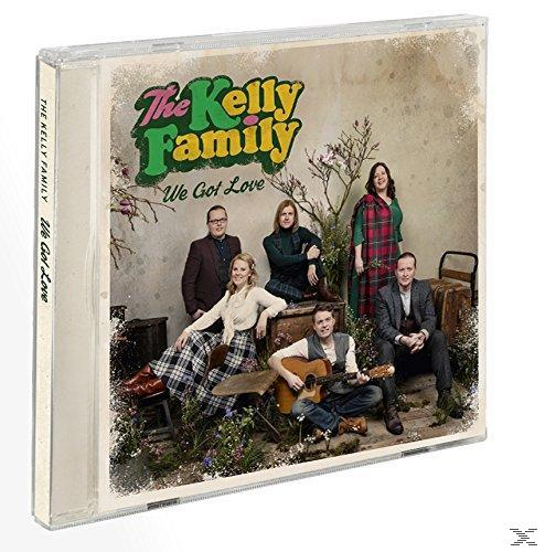 CD tok a The Kelly Family albumhoz. Egy csoportkép zöld és virágos háttérrel.