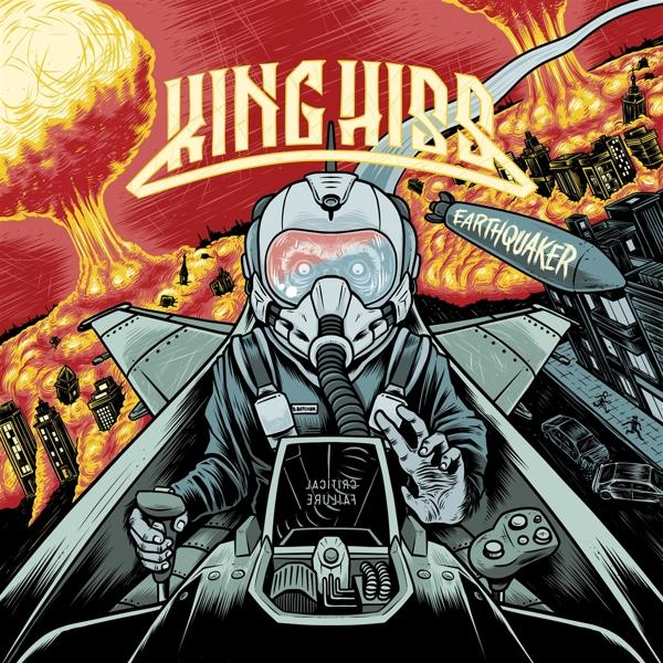 Couverture de l'album King Hiss. Pilote dans un jet avec une bombe, ville en flammes, fond rouge.