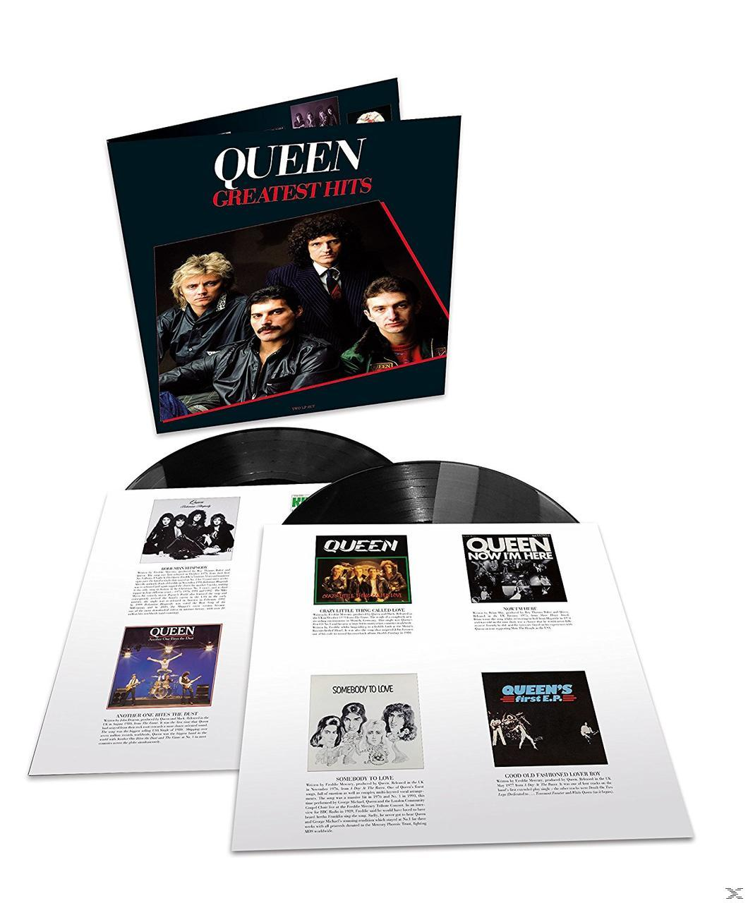 Album Greatest Hits de Queen ouvert. Deux disques noirs, des pochettes d'album et du texte sont visibles.