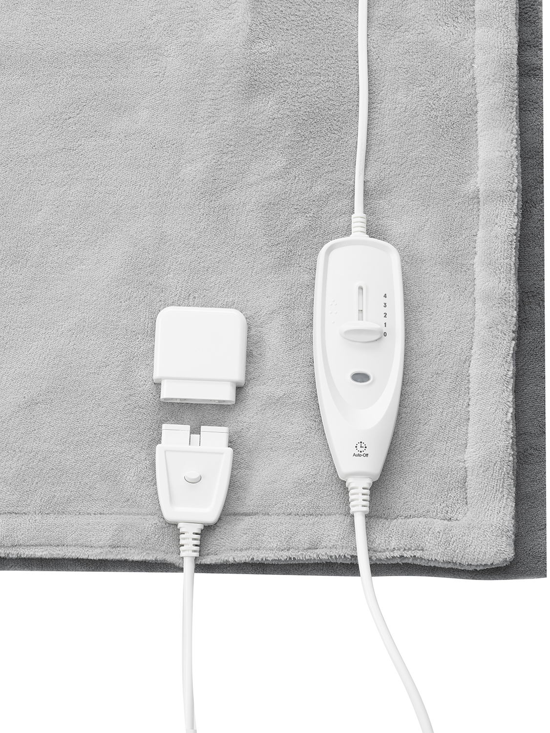 Gray heated blanket with controls and a power connector.