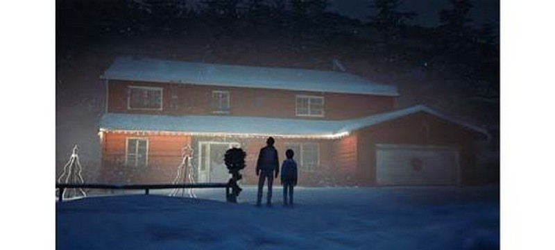 Familia de pie frente a una casa en la nieve por la noche. Fondo oscuro.